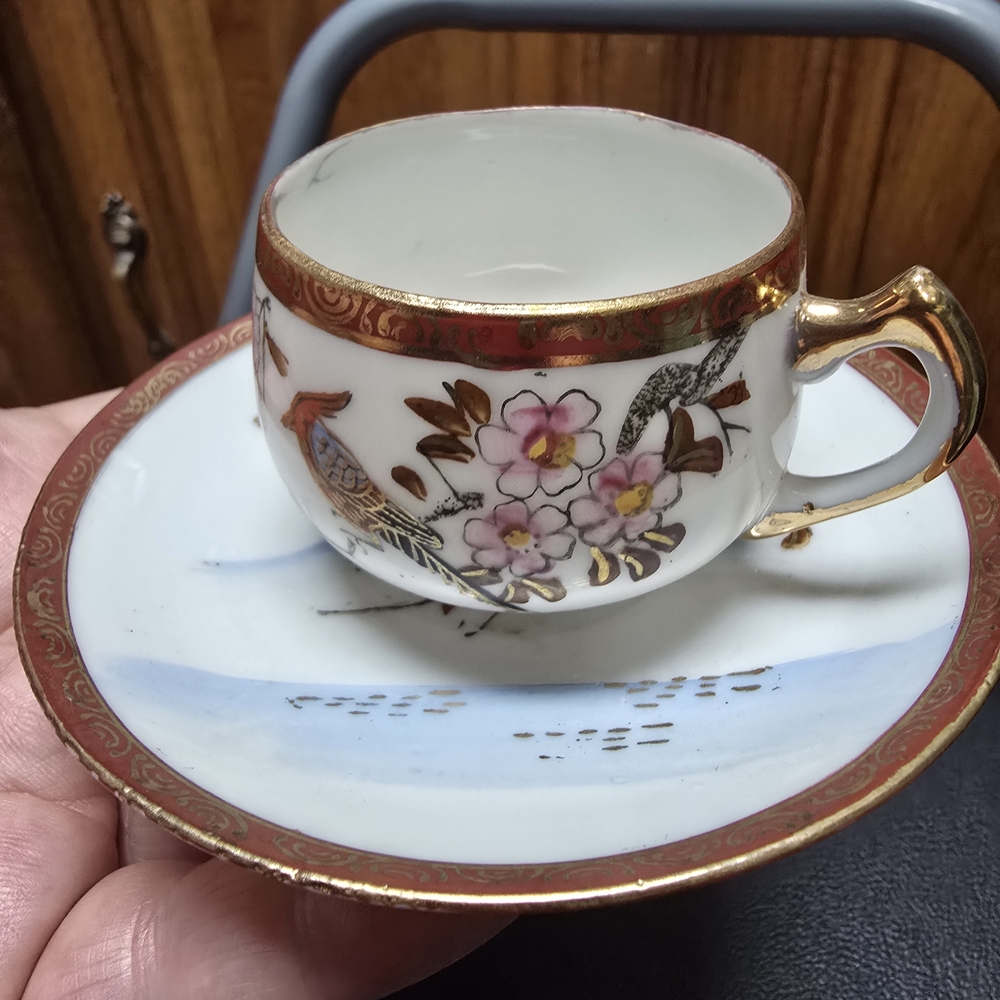 Elegant Gold and White Porcelain Teacup and Saucer Set